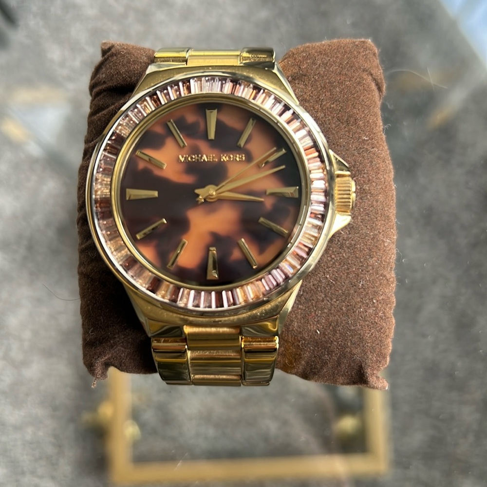 Michael Kors gold watch with leopard dial.